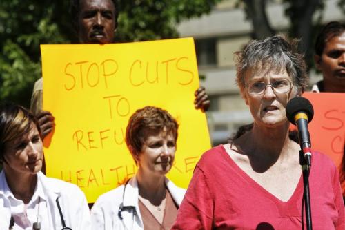 Karin Gordon, Executive Director of Settlement for Hospitality House speaks at a protest at Central Park where local refugees and health care workers gathered to protest federal cuts to refugee health benefits across Canada. 130617 June 17, 2013 Mike Deal / Winnipeg Free Press