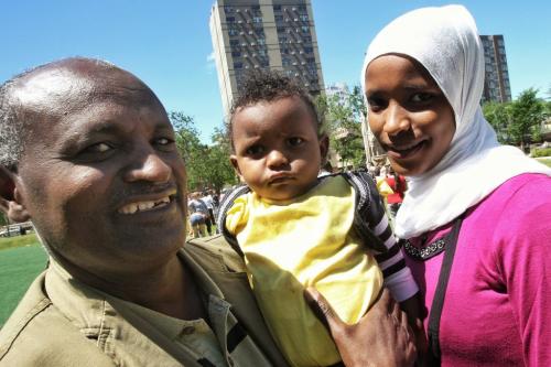Kasim Kawo (left) with his daughter, Milki, 14 months, and wife Balkisa are Oromos who came to Canada from Ethiopia at a protest at Central Park where local refugees and health care workers gathered to protest federal cuts to refugee health benefits across Canada. 130617 June 17, 2013 Mike Deal / Winnipeg Free Press