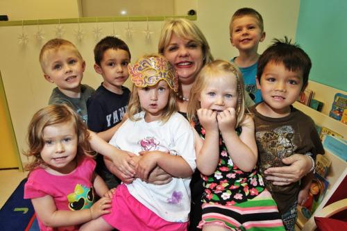 Victoria Sopik CEO and co-founder of Kids & Company with a bunch of children in the preschool classroom at the downtown private child-care facility.  (Front row l-r) Latika, 2, Katie, 3, Marika, 3, and Sage, 4. (Back row l-r) Andres, 4, Cohen, 4, Victoria Sopik, and Donovan, 6. 130617 June 17, 2013 Mike Deal / Winnipeg Free Press
