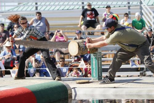 June 17, 2013 - 130617  -  Lauren Tulk and Rob Kane compete in the Jack and Jill Cross Cut Saw during the West Coast Lumberjack Show at the Red River Ex Monday, June 17, 2013. John Woods / Winnipeg Free Press