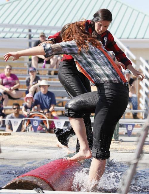 June 17, 2013 - 130617  -  Jaclyn Ramsay defeats Lauren Tulk in the Log Roll during the West Coast Lumberjack Show at the Red River Ex Monday, June 17, 2013. John Woods / Winnipeg Free Press