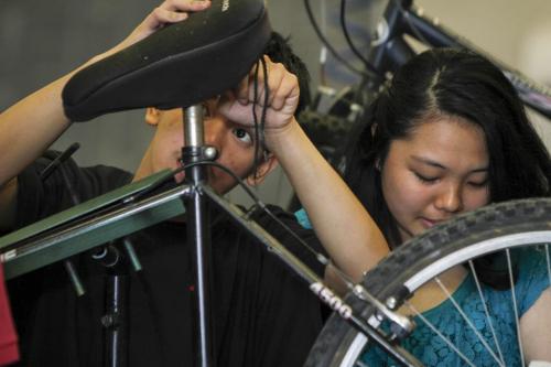 Maples Collegiate Institute students put the finishing touches on bike repairs in the metals workshop today - the last day of an eight week initiative to repair bikes to use and/or donate to the local community to promote active transportation. Education Minister Nacy Allan was in the shop today to announce more than $40 thousand in Education for Sustainable Development (ESD) grants for 22 such projects to promote sustainability and awareness. Tuesday, June 18, 2013. (JESSICA BURTNICK/WINNIPEG FREE PRESS)