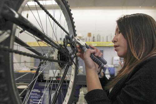 Maples Collegiate Institute 11th grade student Molly Bittern put the finishing touches on a bike repair in the metals workshop today - the last day of an eight week initiative to repair bikes to use and/or donate to the local community to promote active transportation. Education Minister Nacy Allan was in the shop today to announce more than $40 thousand in Education for Sustainable Development (ESD) grants for 22 such projects to promote sustainability and awareness. Tuesday, June 18, 2013. (JESSICA BURTNICK/WINNIPEG FREE PRESS)
