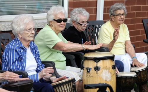 (L-r) Dorothy, Jean, Lorraine and Alma bang away while Chris Scholl teaches a drumming class to a group of seniors at the Lindenwood Manor. 130618 June 18, 2013 Mike Deal / Winnipeg Free Press
