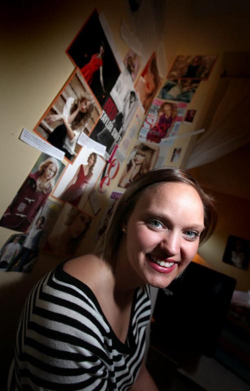 Danielle Mymko, a Taylor Swift "Superfan" poses in her bedroom with some of her TS "stuff" here a cell phone cover. See Carolyn Vesely story. June 18, 2013 - (Phil Hossack / Winnipeg Free Press)