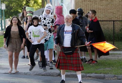 Corydon Ave ,St. Ignatius School .Crossing Guard Bob Sweet  works his final day as a school crossing guard after 11 years at the school , he is known for wearing fun costumes , Wednesday morning , some of the students from the school   dressed  up in costumes to surprise Sweet. KEN GIGLIOTTI / JUNE 19 2013 / WINNIPEG FREE PRESS