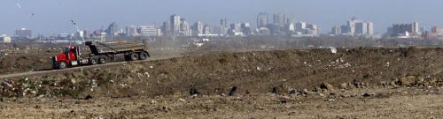 KEN GIGLIOTTI / WINNIPEG FREE PRESS  / Oct  15 2010 - 101015 - Lindsey Wiebe story  Brady Road  Landfill site feature - trucks bring a continus supply of  clay and earth to landscape the pile of garbage at the site. In pic with City of Winnipeg inthe background