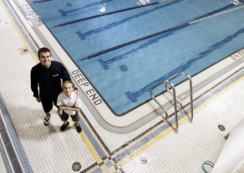 Cameron Krisko (left), age 20, runs Making Waves, a program at Seven Oaks Pool that teaches special needs kids like nine year old Josh Bangert, who has muscular dystrophy, how to swim. Thursday, June 20, 2013. (LINDOR REYNOLDS) (JESSICA BURTNICK/WINNIPEG FREE PRESS)