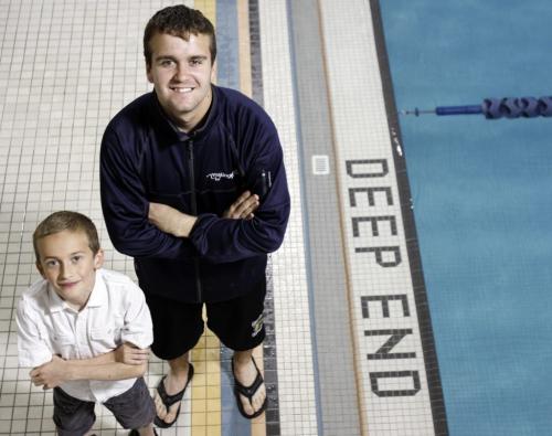 Cameron Krisko (right), age 20, runs Making Waves, a program at Seven Oaks Pool that teaches special needs kids like nine year old Josh Bangert, who has muscular dystrophy, how to swim. Thursday, June 20, 2013. (LINDOR REYNOLDS) (JESSICA BURTNICK/WINNIPEG FREE PRESS)