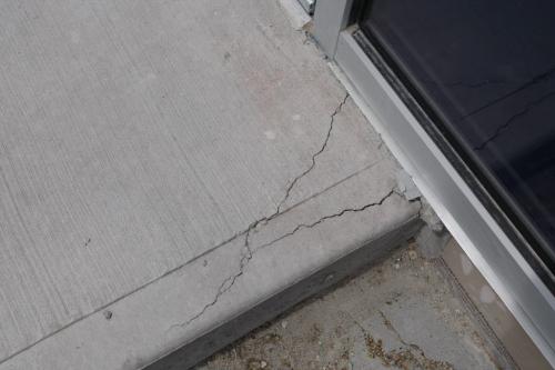 outdoor  sidwalk crack near  Gate 2- Cracks  have been found in the concrete floors and sidewalks at Investor's Group Stadium  KEN GIGLIOTTI / JUNE 20 130613 / WINNIPEG FREE PRESS