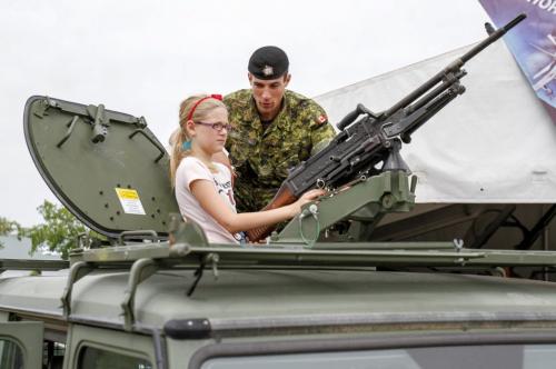 Sergeant Ryan Lagace oversees a visitor to the Canadian Forces display at the Red River Exhibition, which attracted a number of young people on Thursday, June 20, 2013. According to naval Chief Joanne Legge, the display is intended as an educational tool moreso than a recruiting effort. (ELIZABETH FRASER) (JESSICA BURTNICK/WINNIPEG FREE PRESS)