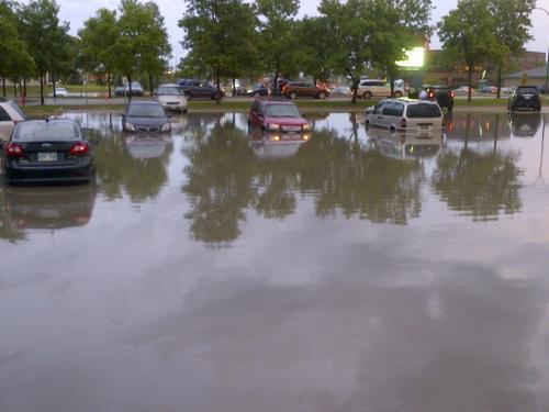Flooding in Grant Memorial church parking lot off Wilkes Avenue. June 20 2013 Bartley Kives photo / Winnipeg Free Press.