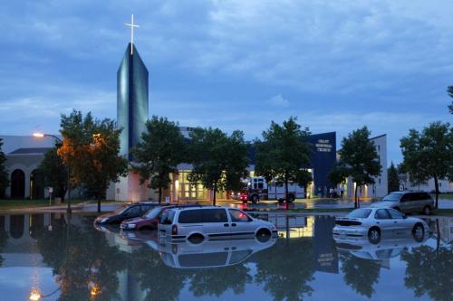 Flash flooding in the parking lot of Grant Memorial Church. BORIS MINKEVICH / WINNIPEG FREE PRESS. June 20, 2013