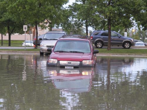 Grant Memorial Church parking lot following June 20 2013 downpour. BARTLEY KIVES/WINNIPEG FREE PRESS