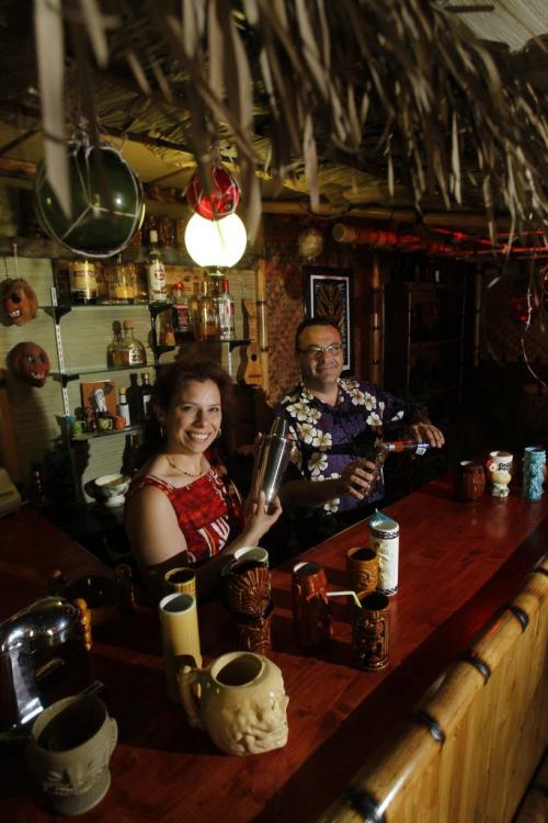 49/8 - INTERSECTIONRon Kerr and his wife Lesley have converted their garage into a full-fledged Tiki lounge. Dave Sanderson story. (WAYNE GLOWACKI/WINNIPEG FREE PRESS) Winnipeg Free Press June 21 2013