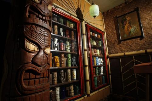 49/8 - INTERSECTIONRon Kerr and his wife Lesley have converted their garage into a full-fledged Tiki lounge. This is some of his mug collection in a cabinet. Dave Sanderson story. (WAYNE GLOWACKI/WINNIPEG FREE PRESS) Winnipeg Free Press June 21 2013