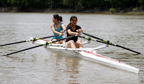 Canada Summer Games hopefuls Hanika Nakagawa (left), 16, and Jaime Wong, 17, take a boat out for a row on the Red River on Saturday, June 22, 2013. The Winnipeg Rowing Club held an open house from 12-4 p.m. (ALEXANDRA PAUL) (JESSICA BURTNICK/WINNIPEG FREE PRESS)