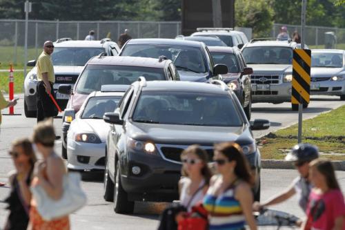 Traffic leading into the Taylor Swift concert working like a well-oiled machine at Investors Group Field on Saturday, June 22, 2013, as it is being directed by event staff and police. (OLIVER SACHGAU) (JESSICA BURTNICK/WINNIPEG FREE PRESS)