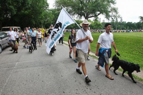 Bill McDonald, CEO at the Winnipeg Humane Society along with hundreds of dogs and their owners walked together during Paws in Motion at Assiniboine Park. The event is Winnipeg Humane Society's biggest annual fundraiser. 130623 June 23, 2013 Mike Deal / Winnipeg Free Press