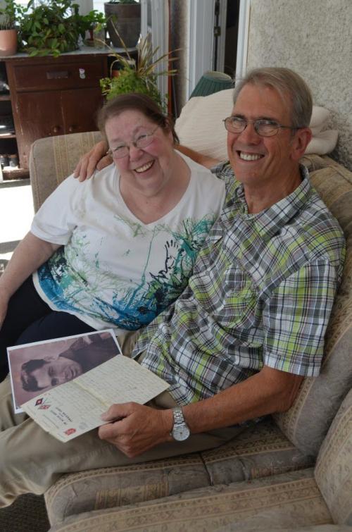 Sheila Cramer and long-lost and finally found half brother Peter Westcott of England look over love letter from their father to Peter's mother during WW2. - there are other photos on file of the shared father and the two mothers. June 24, 2013 (Gordon Sinclair Jr/ Winnipeg Free Press)