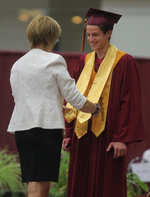 Brandon Sun Crocus Plains valedictorian Aidan Shamray received his honours sash during Monday graduation ceremony. (Bruce Bumstead/Brandon Sun)