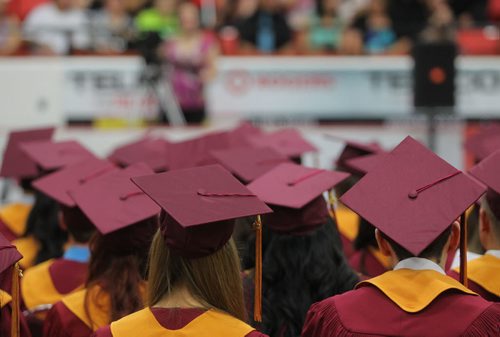 Brandon Sun Students wait for their names to be called to receive their diplomas during Crocus Plains' high school graduation ceremony held at Westman Place on Monday afternoon. (Bruce Bumstead/Brandon Sun)