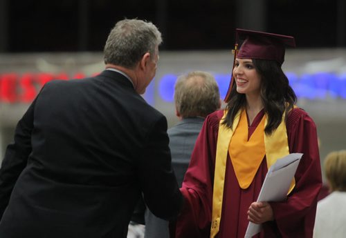 Brandon Sun Alisa Everett is congratulated after receiving her diploma and awards during Crocus Plains' graduation ceremony at Westman Place on Monday. (Bruce Bumstead/Brandon Sun)