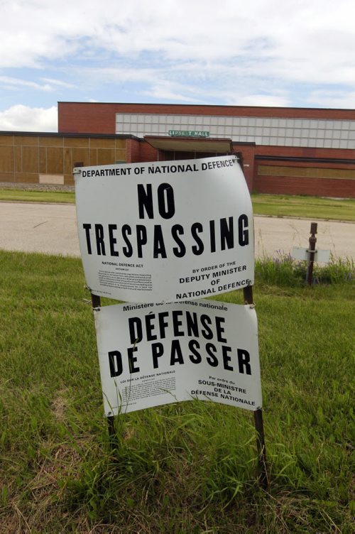 A very weedy, overgrown Kapyong, with the boarded up Lipsett Hall in the background. BORIS MINKEVICH / WINNIPEG FREE PRESS June 28, 2013