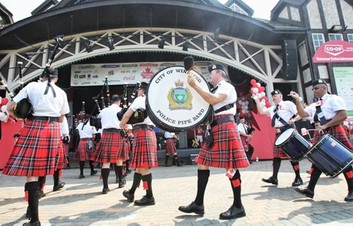 The City of Winnipeg Police Pipe Band march in at the Lyric Theatre in Assiniboine Park Monday afternoon during Canada Day festivities.  130701 July 01, 2013 Mike Deal / Winnipeg Free Press