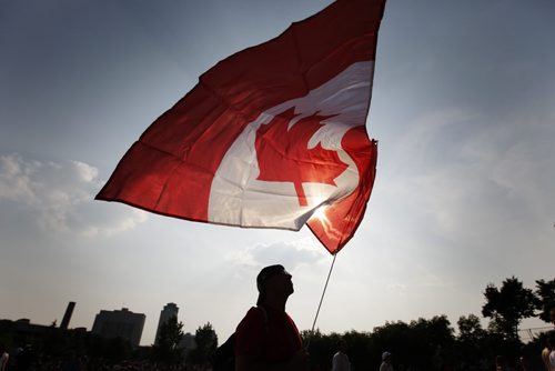 July 1, 2013 - 130701  - Gerry Wert flies his flag high during the Canada Day festivities at The Forks Monday, July 1, 2013. John Woods / Winnipeg Free Press