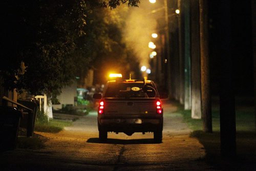 July 7, 2013 - 130707  -  A crew fogs for mosquitos in River Heights back lane Sunday, July 7, 2013. John Woods / Winnipeg Free Press. Fogging truck disperses Melathione (sp?) Mosquito