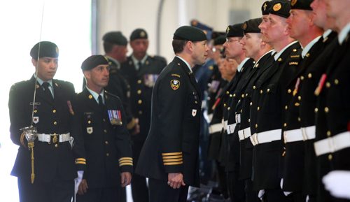 Brandon Sun Reviewing officer Col. Derek Macaulay, Commander 1 Area Cupport Group stopped to talk with members of the CFB/ASU Shilo command unit during Tuesday's Change of Command ceremony. (Bruce Bumstead/Brandon Sun)