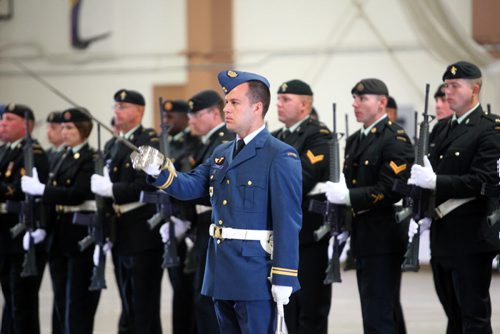 Brandon Sun An officer with the Canadian Forces Base/Area Support Unit Shilo gives a general salute during Tuesday Change of Command ceremony. (Bruce Bumstead/Brandon Sun)