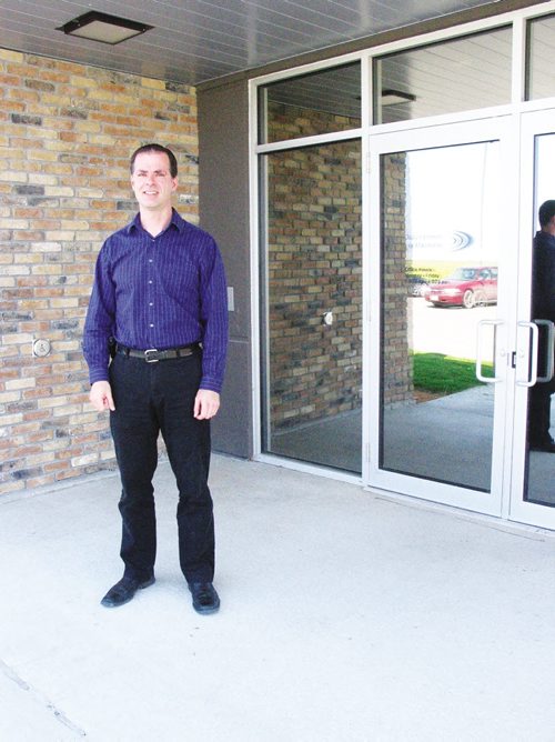 Canstar Community News General manager of the Dairy Farmers of Manitoba Brent Achtemichuk stands outside the organizaton's new office inext to the Red River Exhibition grounds ANDREA GEARY/CANSTAR COMMUNITY NEWS
