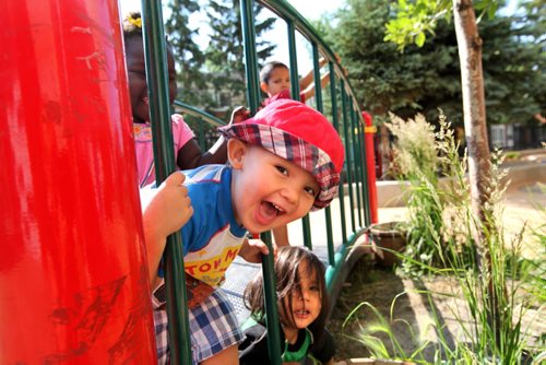 Young William (red hat)  loves playing hide and seek with his playmates at his daycare centre.   At Manidoo - Lord Selkirk Park Childcare Centre children enjoy an interactive environment that will help them fair better once they enter the school system.   See Carol Sanders story for Saturday special.  July 11 , 2013 Ruth  Bonneville , Winnipeg Free Press