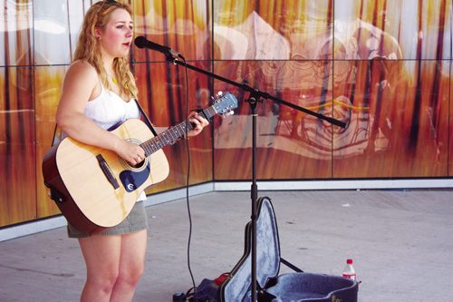 Canstar Community News Windsor Park resident Mikayla Zacharias performs a tune during the Transcona BIZ Market Garden opening at the Transcona Centennial Square on July 4. (DAN FALLOON/CANSTAR COMMUNITY NEWS)