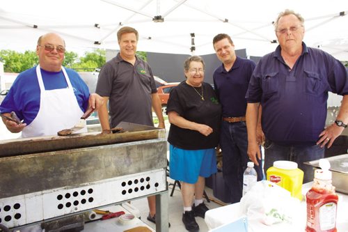 Canstar Community News Lorne Tyson, Elmwood-Transcona MP Lawrence Toet, Jeanne Rudniski, James Teitsma and Cam Wortman are shown at a fundraising barbecue at the Transcona BIZ Market Garden at Transcona Centennial Square on July 4. The barbecue raised over $1000 for the Canadian Red Cross to help Alberta flood victims. (DAN FALLOON/CANSTAR COMMUNITY NEWS)