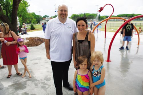 Canstar Community News Coun. Russ Wyatt (Transcona) is shown with Brittany King and her daughters Lola and Roxie during the Transcona Splash Park opening on June 28. (DAN FALLOON/CANSTAR COMMUNITY NEWS)