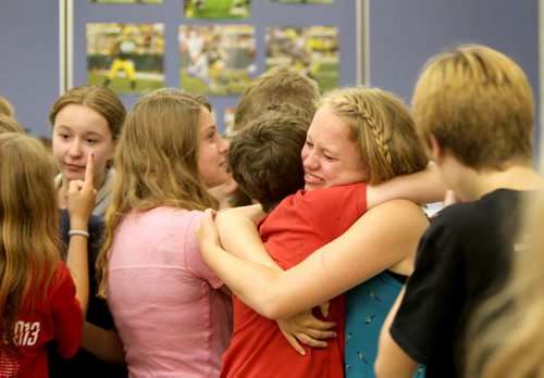 Grade 8 Windsor School students  spend the final moments on the last day of school writing in each others yearbooks, cleaning out lockers and sharing tearful goodbyes as they transition from grade school to High School in the fall of this year.  Some of the students have been attending Windsor School  with the same group of friends since kindergarden. Although most of the students will be going to Glenlawn Collegiate some have plans to attend a different high school.  Photo's taken on June 28, 2013 Class of 2017 Doug Speirs story.  July 11 , 2013 Ruth  Bonneville , Winnipeg Free Press