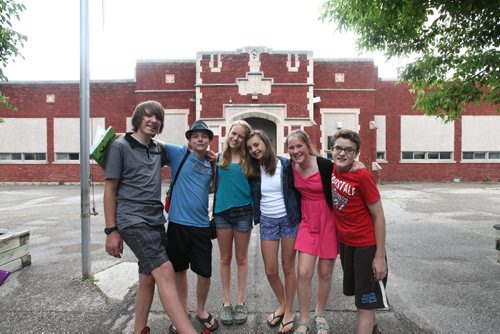 A group of Windsor School students pose for a photo outside their school on their last day.  Names from left to right  - Garrett, Quinn, Hailey, Aby, Sarah and Noah (red).  Grade 8 Windsor School students  spend the final moments on the last day of school writing in each others yearbooks, cleaning out lockers and sharing tearful goodbyes as they transition from grade school to High School in the fall of this year.  Some of the students have been attending Windsor School  with the same group of friends since kindergarden. Although most of the students will be going to Glenlawn Collegiate some have plans to attend a different high school.  Photo's taken on June 28, 2013 Class of 2017 Doug Speirs story.  July 11 , 2013 Ruth  Bonneville , Winnipeg Free Press