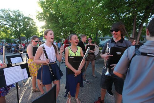 Grade 8 Windsor School band students  gather up their instruments and head back into school after they performed for parents and teachers outside the school for the last time before they graduate into high school. Students in foreground of photo - Left to  Right Sydney, Aby and Garrett. Class of 2017 Doug Speirs story.  July 11 , 2013 Ruth  Bonneville , Winnipeg Free Press