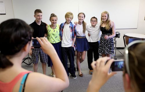 Grade 8 Windsor School students grab some group photos just before they perform for parents and teachers outside the school  the last time before they graduate into high school. Names of students posing for photo  Left - Right Liam, Aby, Avery,  Sydney, Noah and Hailey.  Class of 2017 Doug Speirs story.  July 11 , 2013 Ruth  Bonneville , Winnipeg Free Press