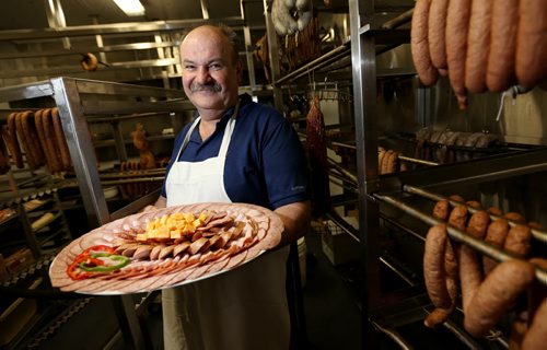 Jan Leszczynski, owner of M&S Meat Market with a platter of meat, Saturday, July 13, 2013. (TREVOR HAGAN/WINNIPEG FREE PRESS) - restaraunt review