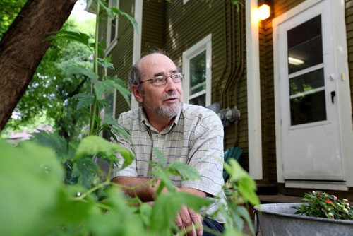 Mike Maunder on his deck at his Spence Street home which is classified as a rooming house. See Mary Agnes story on rooming houses.  July 16, , 2013 Ruth  Bonneville , Winnipeg Free Press