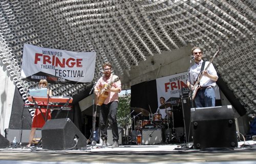 Local Winnipeg band Federal Lights performs at The Cube at the official kickoff of the Winnipeg Fringe Festival at Old Market Square in the Exchange District, filling it chock full of music, dancing and colourful characters. Wednesday, July 17, 2013. (JESSICA BURTNICK/WINNIPEG FREE PRESS)