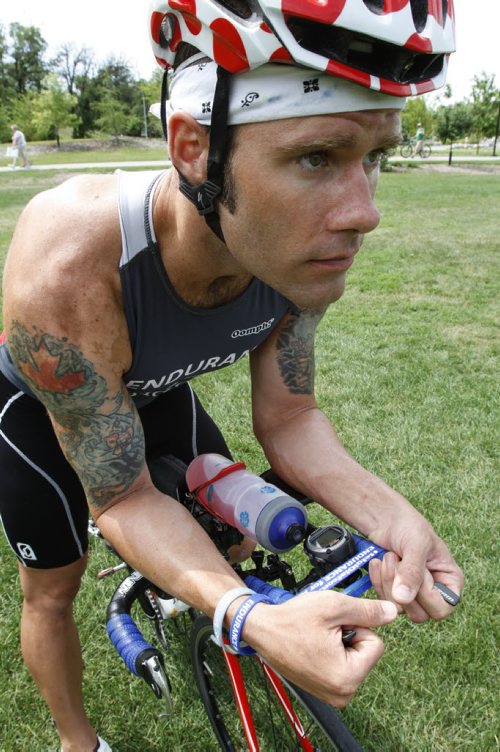 Winnipeg-born Helgi Olafson, 30, who now lives in Hawaii, was diagnosed with Ankylosing Spondylitis at the age of 19, an autoimmune disease similar to rheumatoid arthritis. He is now racing across North America to raise money and awareness around the disease, and competed in the Morden triathlon last week. Wednesday, July 17, 2013. (SHAMONA HARNETT) (JESSICA BURTNICK/WINNIPEG FREE PRESS)