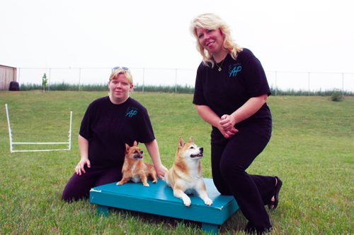 Canstar Community News July 10, 2013 - Miranda Jonasson and mother Karen, who are partners in Active Paws agility classes, are shown with dogs Shilah and Roxi at their Transcona home.