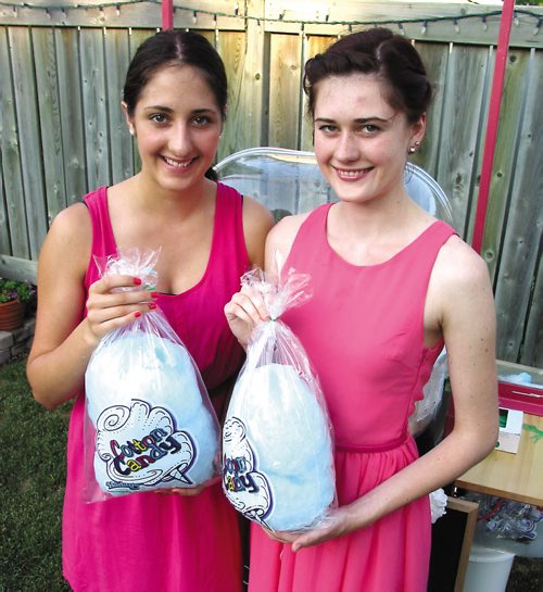 Canstar Community News July 17, 2013 -- Riah (left) and Keana Wallwin are busy building a cotton candy empire. (SIMON FULLER/CANSTAR NEWS)