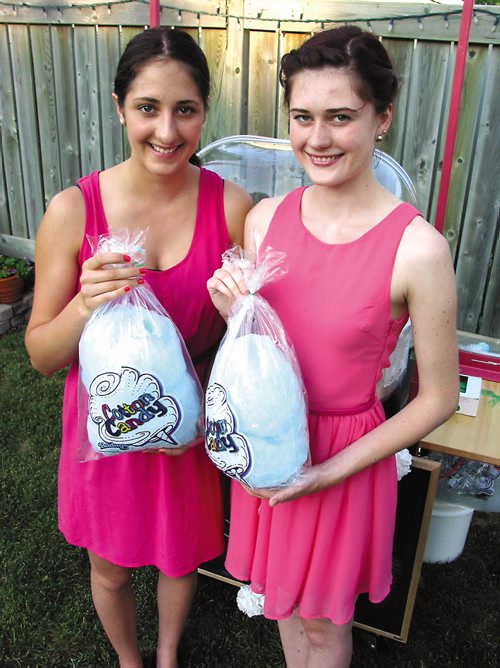 Canstar Community News July 17, 2013 -- Riah (left) and Keana Wallwin are busy building a cotton candy empire. (SIMON FULLER/CANSTAR NEWS)