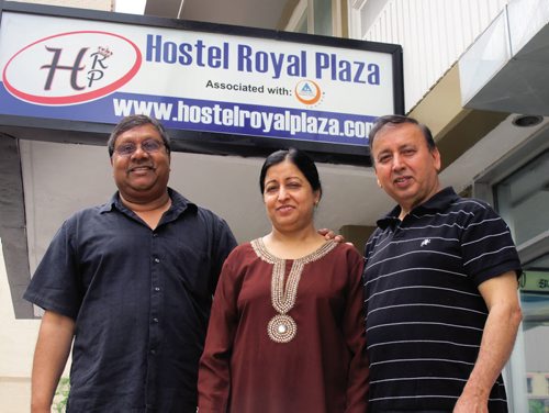 Canstar Community News 10/07/2013- Suroj (centre) and Ashwani Nagpal (right) owners of the Hostel Royal Plaza with their construction manager Manny Singh (left) outside their new establishment at 330 Kennedy St. downtown Winnipeg. The Nagpals want their hostel to be a home away from home for international students. Photo by Steph Crosier